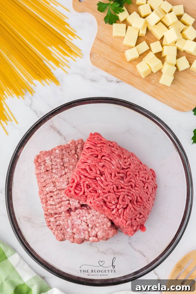 Slow Cooker Cheesy Stuffed Meatball Magic 7 Combining breadcrumb mixture with ground meat