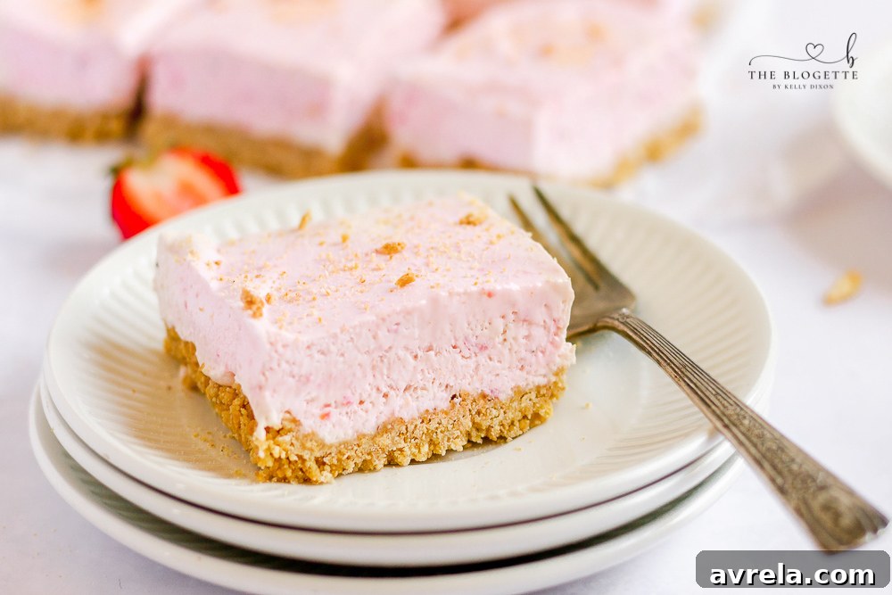 Close-up of a delicious Strawberry Cheesecake Bar slice.