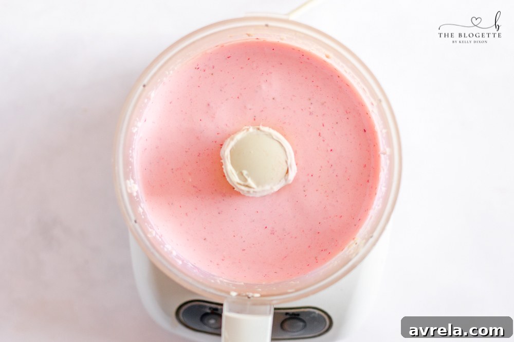 Close-up of creamy strawberry cheesecake filling.