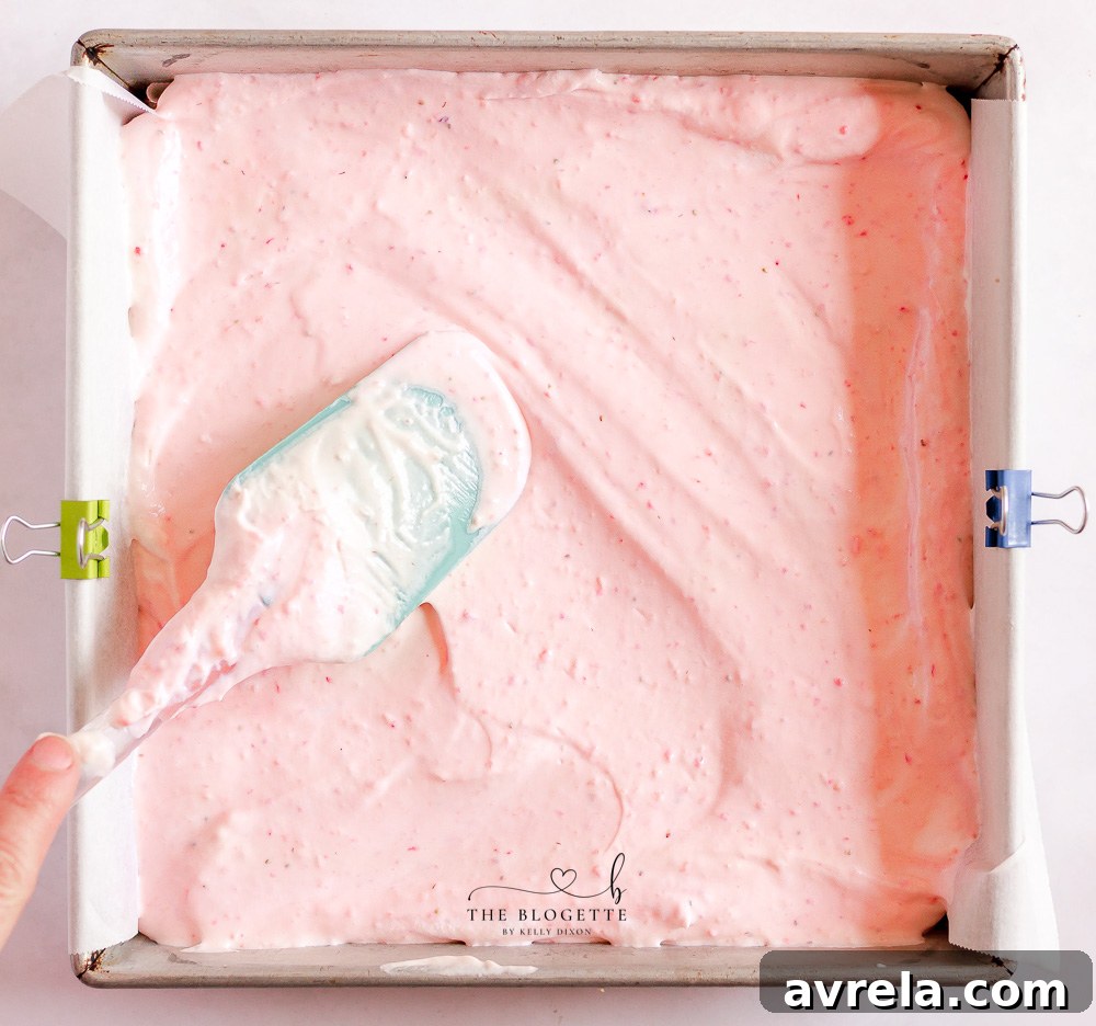 Finished Strawberry Cheesecake Bars being frozen before serving.