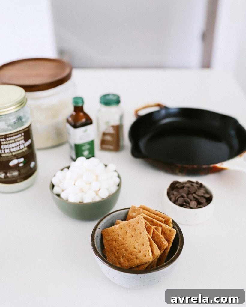 Gooey S'mores Cookie Skillet with melted chocolate, toasted marshmallows, and graham cracker bits