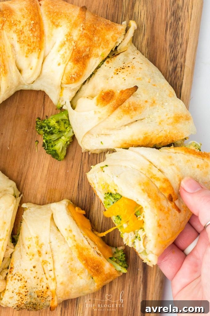 Close-up of a golden-brown Cheesy Chicken and Broccoli Ring, showcasing its delicious texture and filling.
