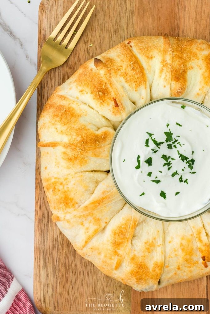 A slice of the Cheesy Chicken and Broccoli Ring on a plate, ready to be enjoyed.