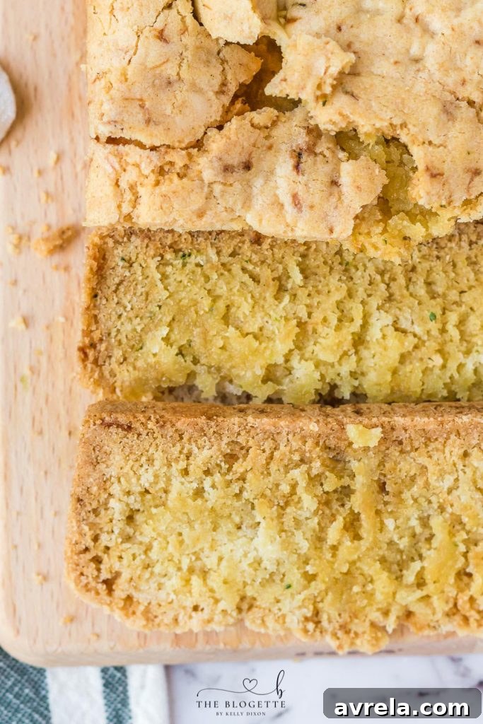 Close-up of Amish Zucchini Bread, showing its golden-brown crust and inviting texture, ready for a taste.