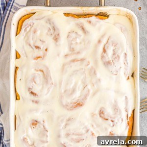 Fall Pumpkin Spice Swirls 12 Fluffy Pumpkin Cinnamon Rolls topped with an addicting homemade glaze and filled with a buttery pumpkin spice sugar blend.
