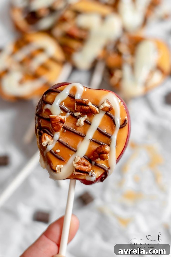 Caramel Apple Slices with various toppings laid out on parchment paper