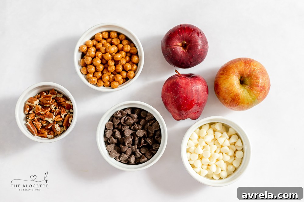 A selection of fresh apples, caramel, and chocolate chips ready for making caramel apple slices.