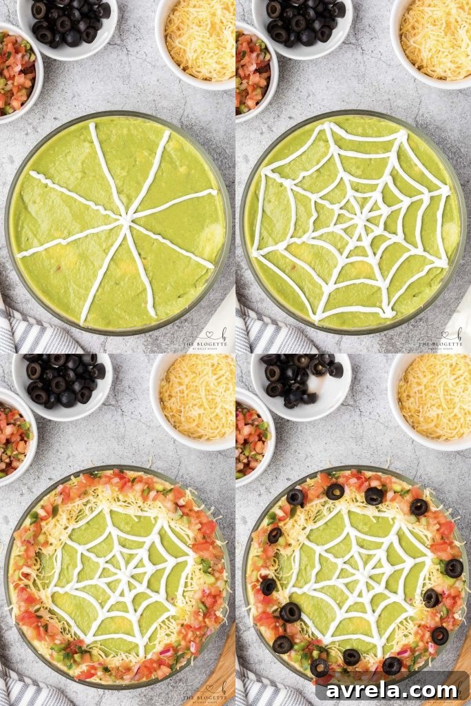 A beautifully piped sour cream spider web on a layer of guacamole, ready for Halloween.