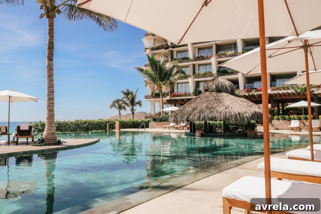 Grand Velas Los Cabos exterior, showing a luxurious resort building under a clear sky.
