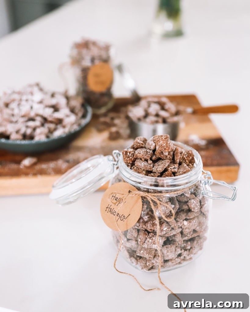 Multiple jars filled with Muddy Buddies, decorated with festive ribbons, ready as holiday gifts.