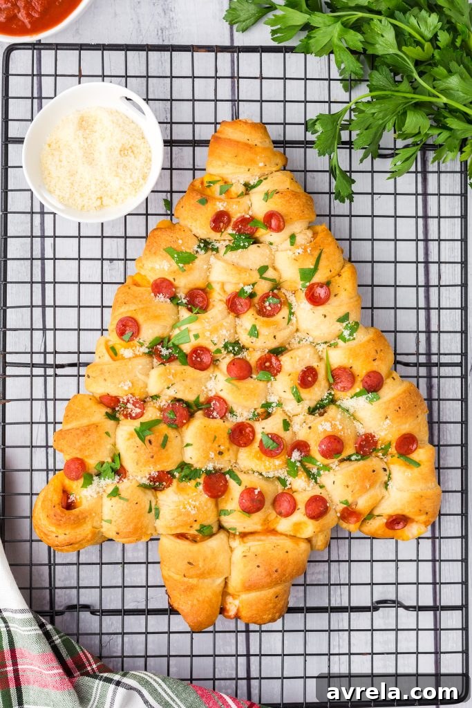 Christmas Tree Tear and Share Bread 10 A festive Christmas Tree Pull Apart Bread with pepperoni and cheese, showcasing its ease, versatility, and ability to make everyone smile during the holidays.