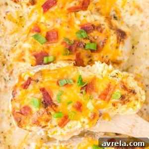 This Million Dollar Chicken recipe is easy, cheesy, and smothered in a special cream sauce, then topped with bacon!