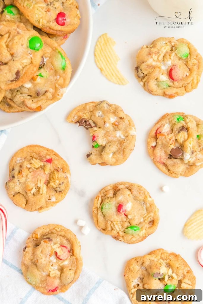 Kitchen Sink Christmas Cookies are sweet-and-salty, chewy-and-gooey cookies with M&M's, chocolate chips, pretzels, marshmallows, potato chips... everything but the kitchen sink!