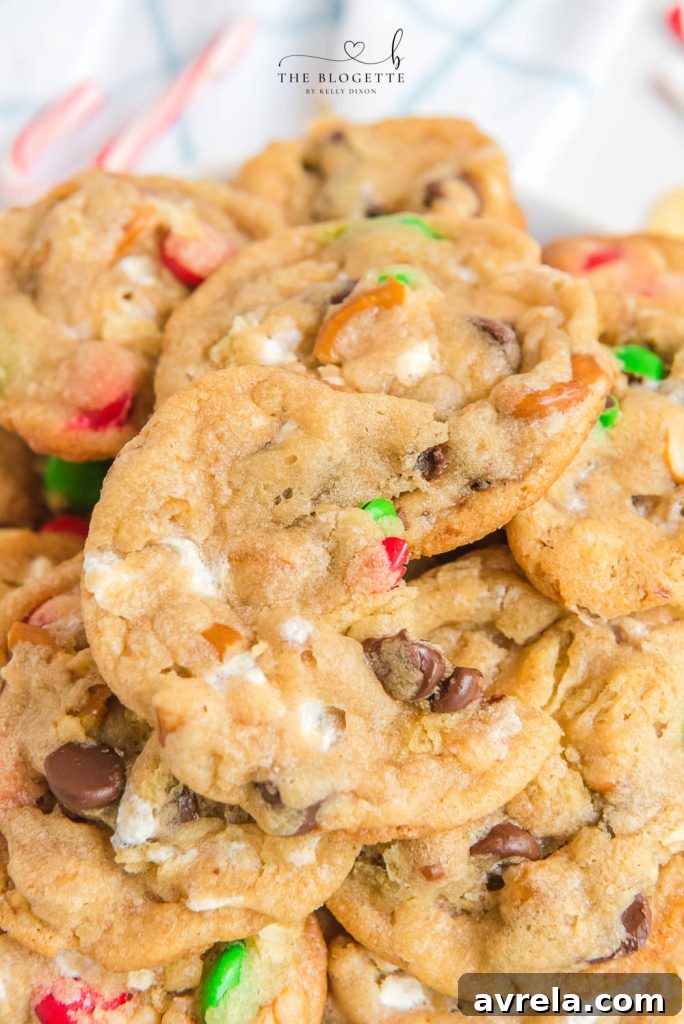 Kitchen Sink Christmas Cookies are sweet-and-salty, chewy-and-gooey cookies with M&M's, chocolate chips, pretzels, marshmallows, potato chips... everything but the kitchen sink! 