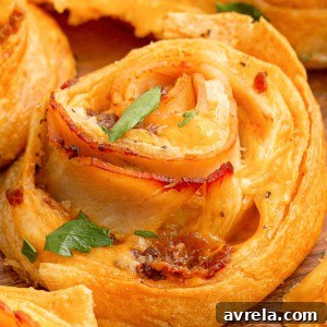 Baked Turkey and Cheese Rolls have melted cheese, bacon, and turkey covered in a garlic buttery glaze! The perfect party appetizer idea!