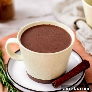 Gingerbread Hot Chocolate is Christmas in a cup! It's like drinking a chocolate gingerbread cookie!