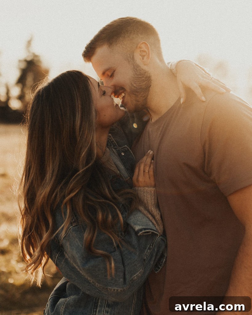 A candid photo capturing the bride-to-be and groom-to-be sharing a tender moment, radiating happiness.