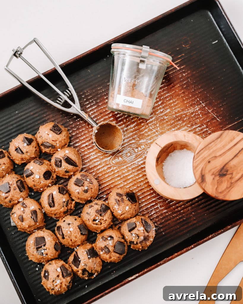 Warm and inviting Chai Chocolate Chip Cookies fresh out of the oven, sprinkled with sea salt.