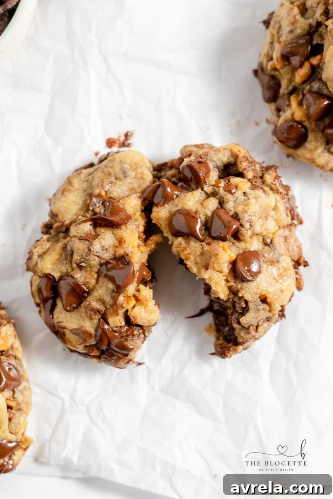 A stack of warm, thick, and soft chocolate chip cookies, a perfect bakery-style treat.