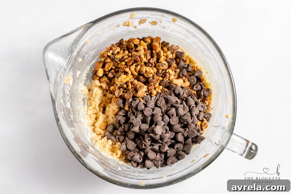 Creaming butter and sugars to form the base of the homemade chocolate chip cookie dough.
