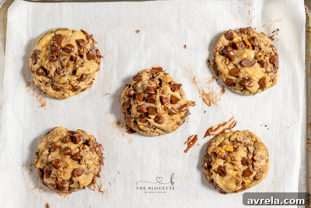 Freshly baked homemade chocolate chip cookies cooling on a wire rack.