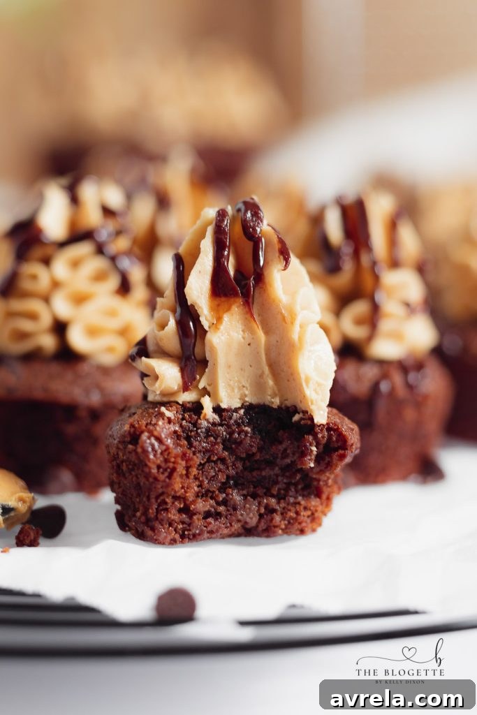 Close-up of a single Buckeye Brownie bite on a plate, showing its layers