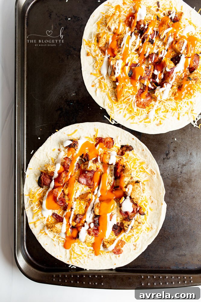 Buffalo Chicken Bacon Quesadillas being baked on a tray
