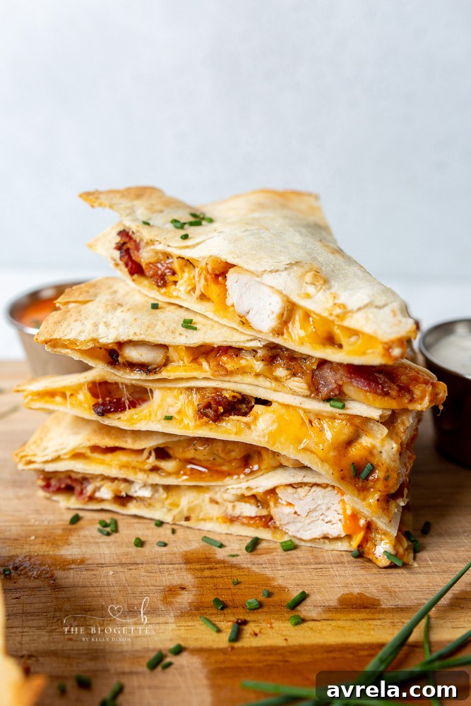 The perfect Buffalo Chicken Bacon Quesadillas on a plate with dipping sauce
