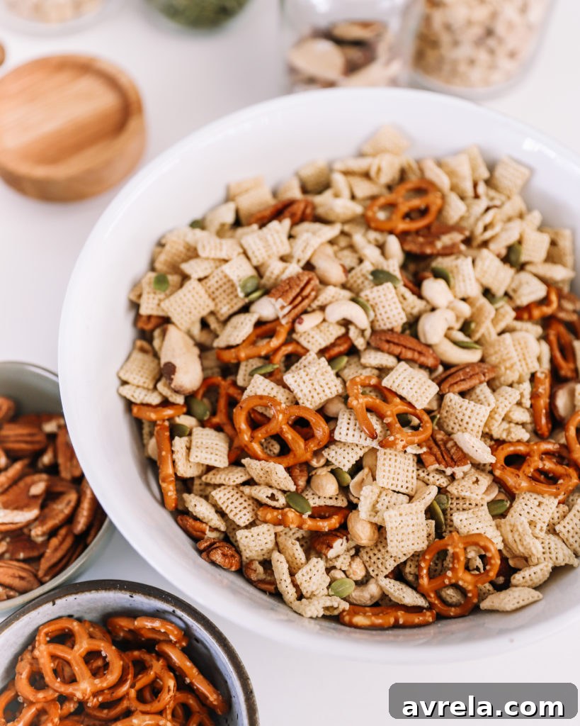 Mixing bowl with Rice Chex and nuts before seasoning