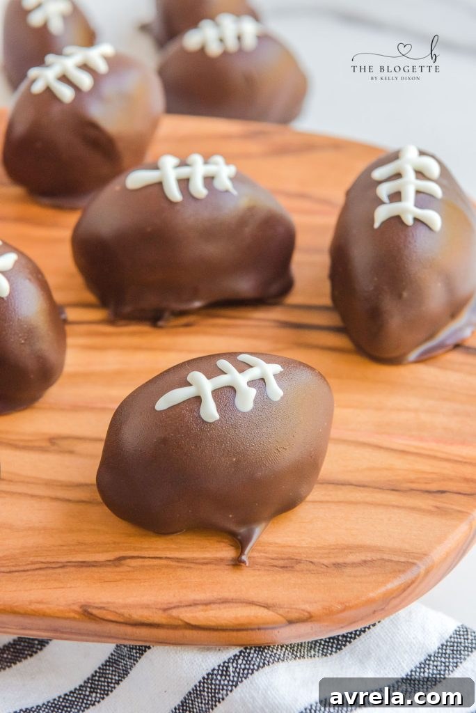 Delicious Oreo Football Truffles ready for a Super Bowl party or tailgating, featuring the classic Oreo flavor in a festive football shape.