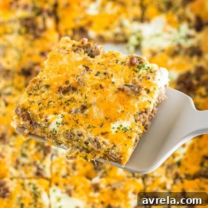 The best Breakfast Sausage Casserole with a layer of cheese, eggs, crescent dough, and sausage!