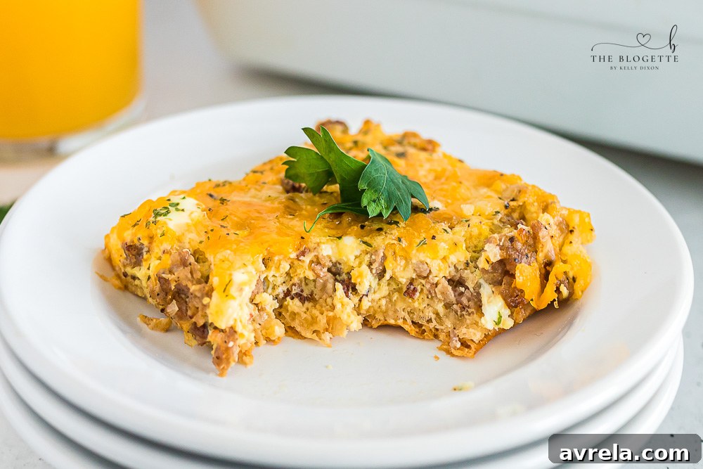 The best Breakfast Sausage Casserole with a layer of cheese, eggs, crescent dough, and sausage!