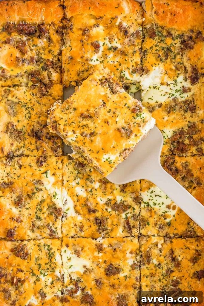 The best Breakfast Sausage Casserole with a layer of cheese, eggs, crescent dough, and sausage!