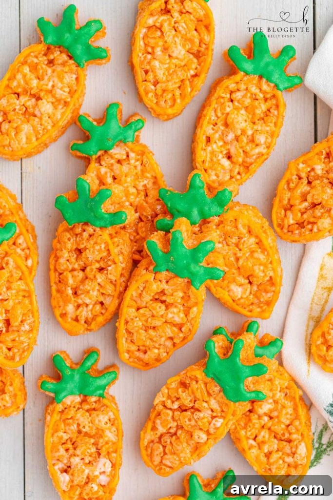 Carrot Rice Krispie Treats are a perfect Easter dessert! Everyone's favorite Rice Krispies Treats turned into little carrots.