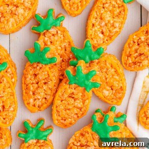 Carrot Rice Krispie Treats are a perfect Easter dessert! Everyone's favorite Rice Krispies Treats turned into little carrots.