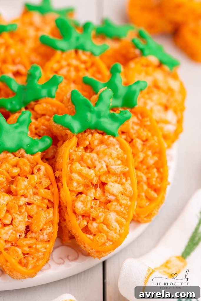 Carrot Rice Krispie Treats are a perfect Easter dessert! Everyone's favorite Rice Krispies Treats turned into little carrots.