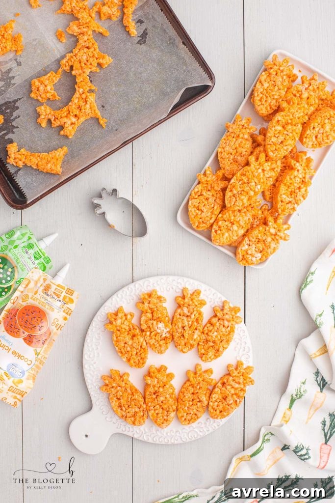 Rice Krispies Treats spread evenly on parchment paper