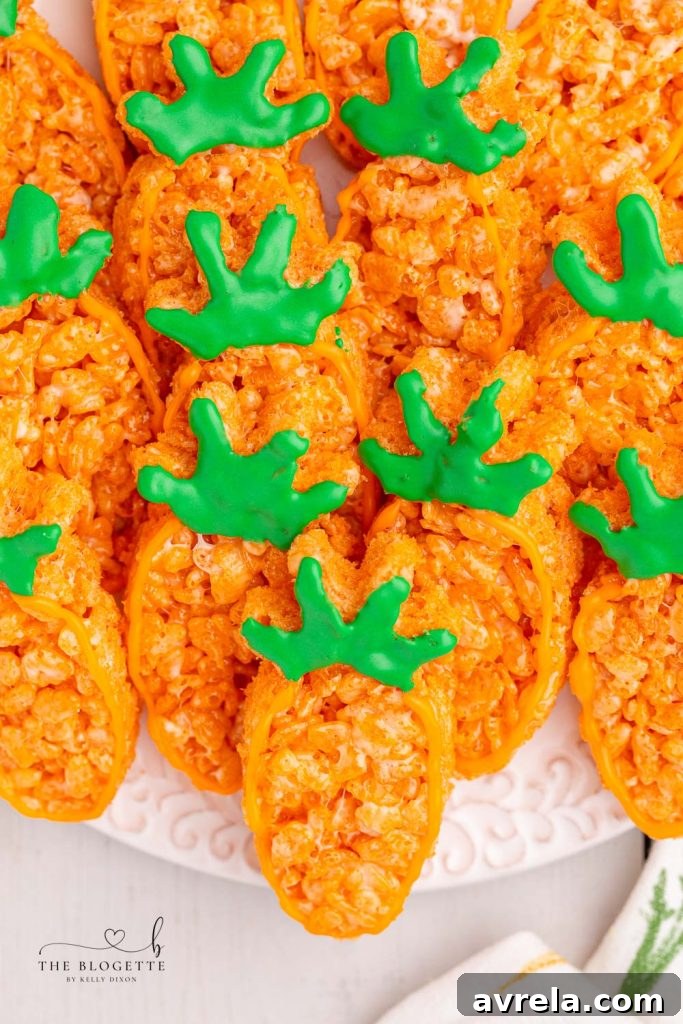 Decorating Carrot Rice Krispie Treats with icing