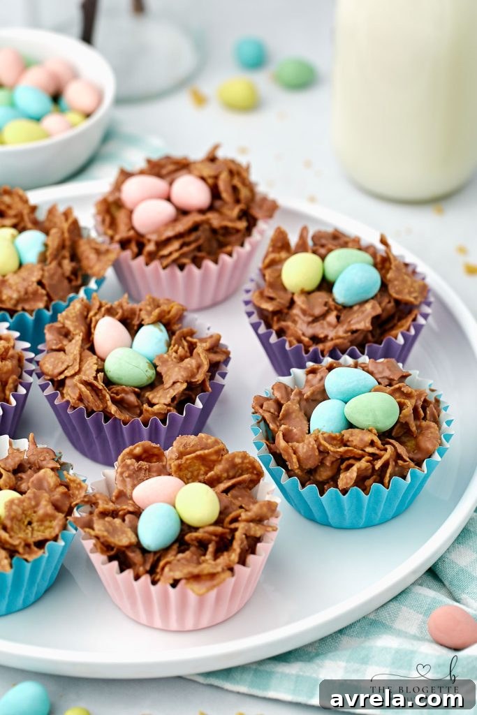 Chocolate Egg Nests made with cornflakes are the perfect Easter treat! An easy, no-bake Easter dessert idea that kids can help make, filled with mini eggs.