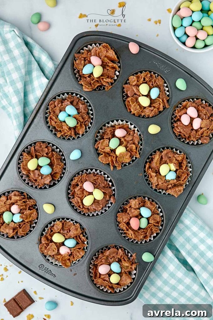 Chocolate Egg Nests made with cornflakes are the perfect Easter treat! This an easy, no-bake Easter dessert idea that kids can help make, filled with mini eggs to make adorable bird nests!