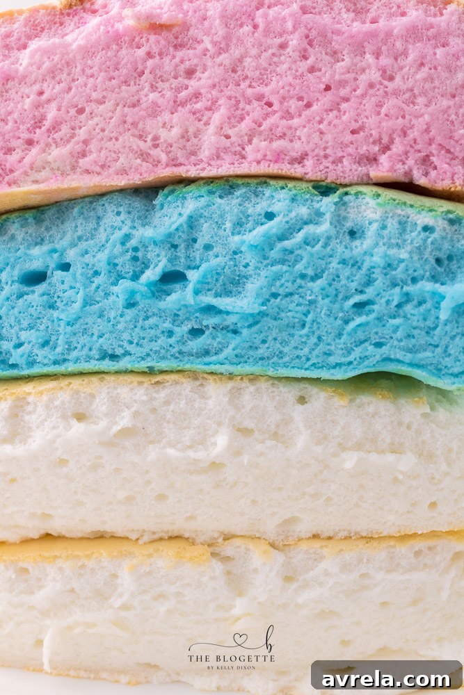 Soft and fluffy cloud bread is easy to make and tastes almost like cotton candy! It is fun to rip open, revealing the colorful bread inside.