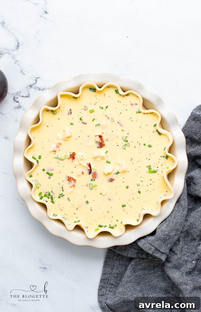 Maple Glazed Bacon Breakfast Bake 7 Egg and potato mixture poured into a pie crust, ready for baking.