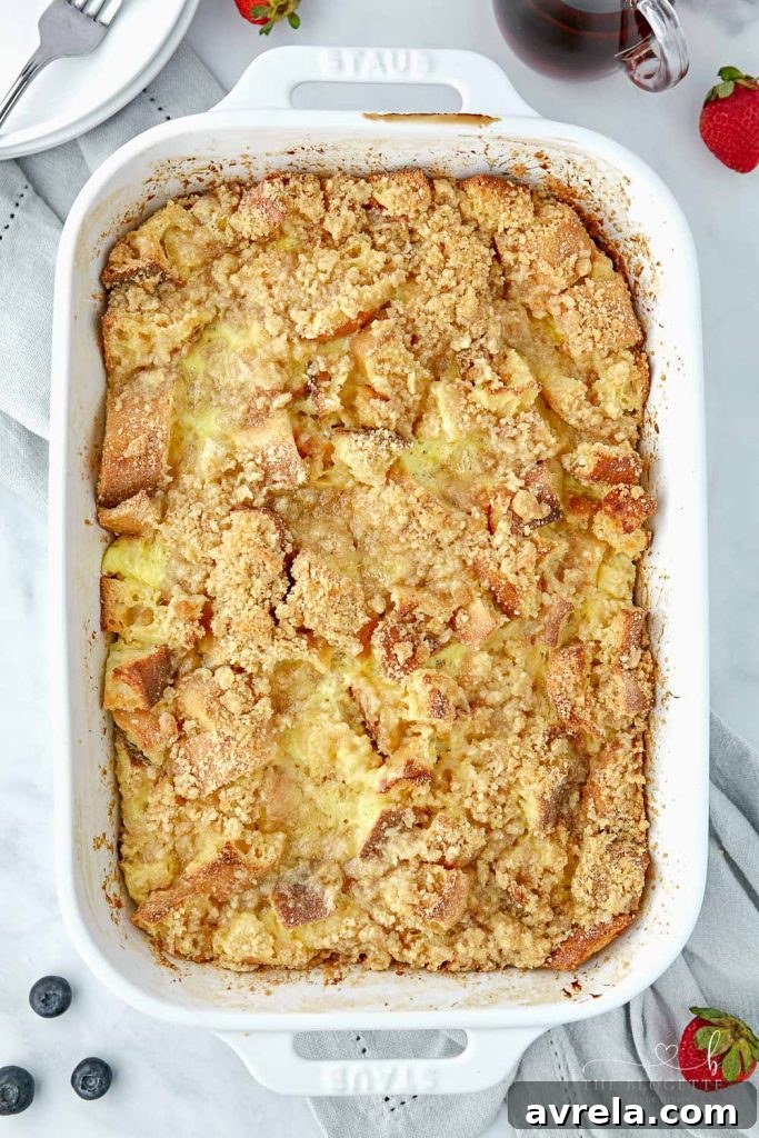 Morning Glory French Toast Bake 13 Multiple topping ideas for French Toast Casserole laid out, including maple syrup, powdered sugar, and fresh berries.