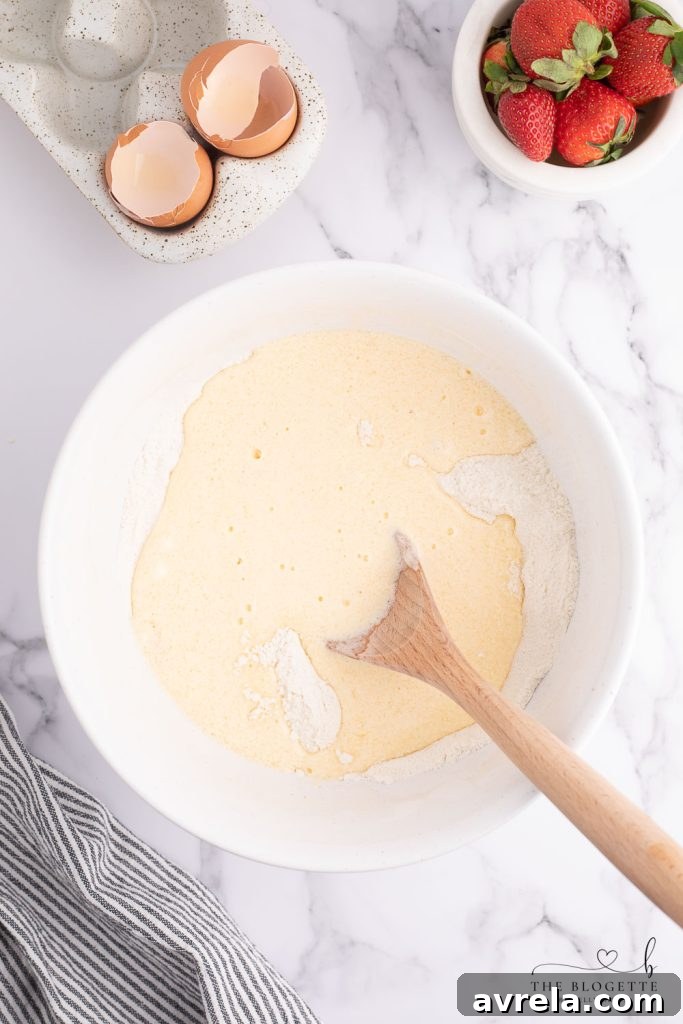 Mixing bowl with bread dough, showing a soft, consistent texture.