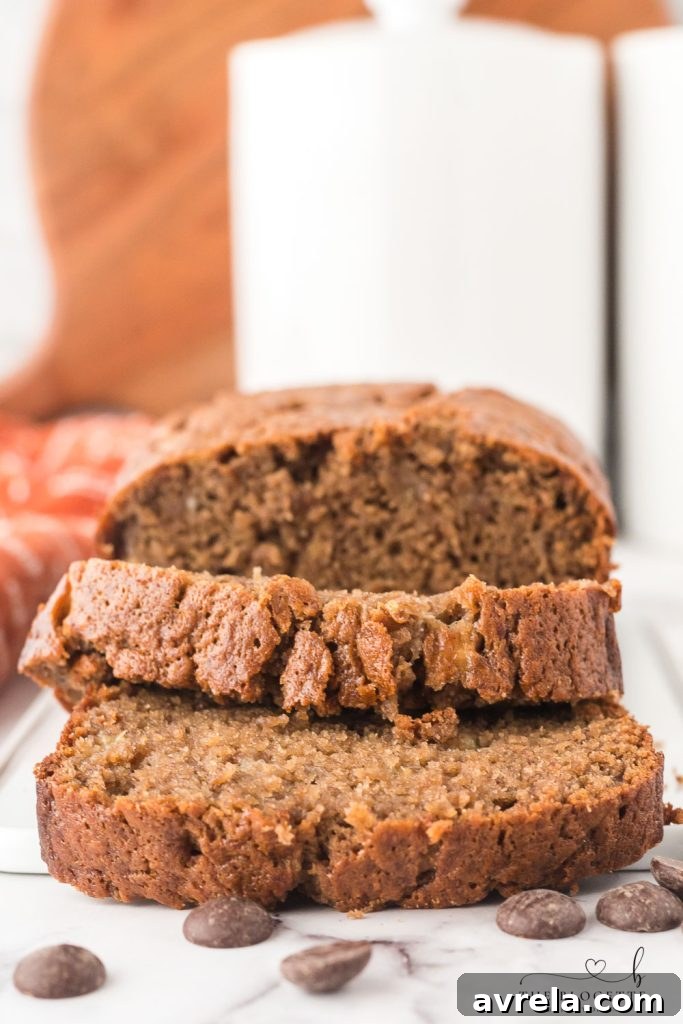Moist Chocolate Chip Banana Loaf 3 A perfectly baked loaf of homemade Chocolate Banana Bread, ready to be sliced and enjoyed.