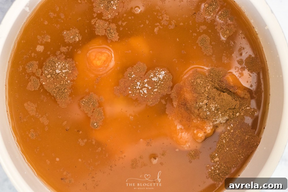 Velvet Pumpkin Risotto 4 Pumpkin puree and chicken broth simmering in a pot, creating the flavorful base for risotto.