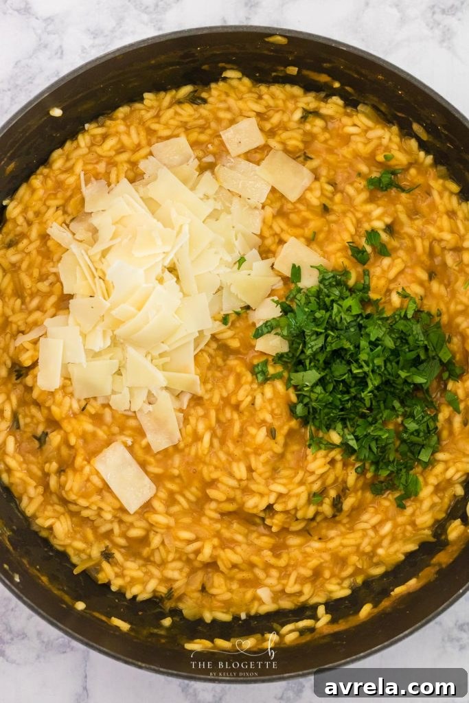 Velvet Pumpkin Risotto 6 Close-up of the Arborio rice gradually absorbing the pumpkin-infused broth, stirred continuously in a pan.