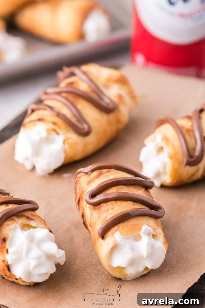 Fireside Eclairs 10 Decadent Campfire Éclairs are the perfect camping recipe and are sure to be the highlight of your summer camping trip!