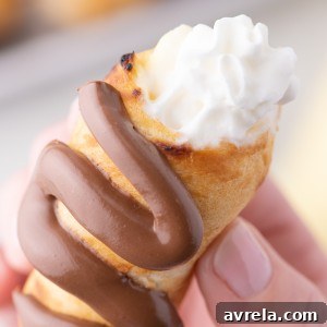 Decadent Campfire Éclairs are the perfect camping recipe and are sure to be the highlight of your summer camping trip!