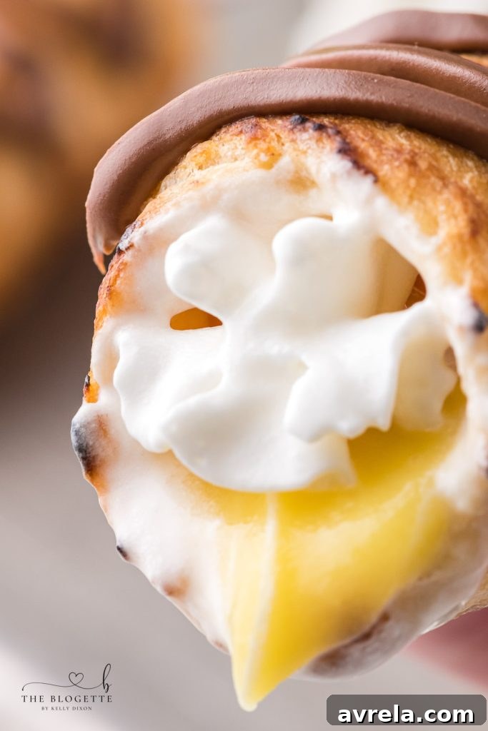Fireside Eclairs 3 Decadent Campfire Éclairs are the perfect camping recipe and are sure to be the highlight of your summer camping trip!